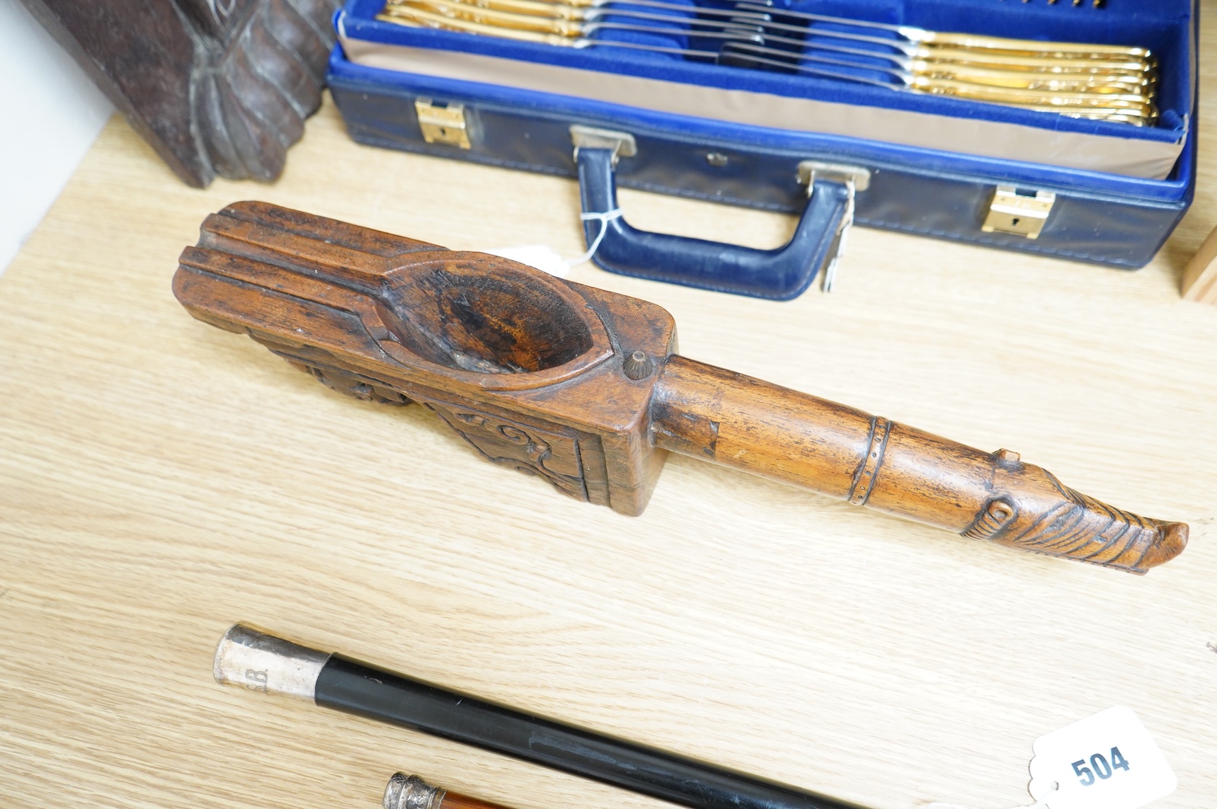 An 18th / 19th century Indian carved wood oil pourer, 43cm